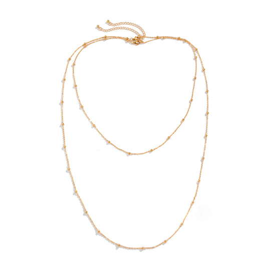 Damen doppelt gelegte Lange Halskette mit den zarten Perlen Goldfarbene Schmuck Modeschmuck